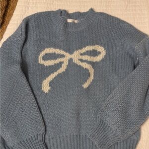Blue Sweater with White Bow Design